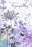 This sympathy card feels like a delicate visual poem, crafted with the same care a local florist brings to arranging a condolence bouquet for families in Bexleyheath. Across the card, airy silhouettes of wildflowers reach upward in long, graceful lines. Their fine stems, slightly curved and tapering, end in rounded umbels composed of tiny, lace-like florets. These blooms are painted in a cool, soothing palette-lavenders, indigos, and soft blues-softened further by touches of silvery green that trace the stems and occasional leaves. The colours bleed subtly into one another in true watercolour fashion, creating gentle transitions and a sense of depth without ever becoming heavy. Behind the flowers, a veil of muted purple and translucent blue spreads across the background, leaving edges that fade into soft white. It looks like an evening sky clearing after rain over the rooftops and parkland near Bexleyheath, a moment when the world seems to exhale. Scattered among the stems, butterflies hover in near-transparent outlines, their wings spread in mid-flight as if they've just risen from the blossoms. They introduce an understated symbolism of transformation and ongoing presence-subtle but deeply felt. The entire composition is light, balanced, and quiet, inviting the viewer to pause. As Flower Delivery Bexleyheath, we often see how such a card, paired with simple, fresh sympathy flowers, offers more than just an image; it provides a gentle refuge for the heart. The design doesn't attempt to fix grief, but rather to sit beside it, bringing comfort through soft colour, elegant movement, and the timeless language of wildflowers and butterflies.